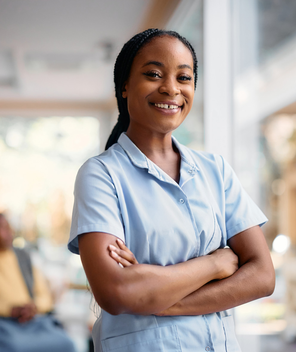 Woman smiling with her arms crossed