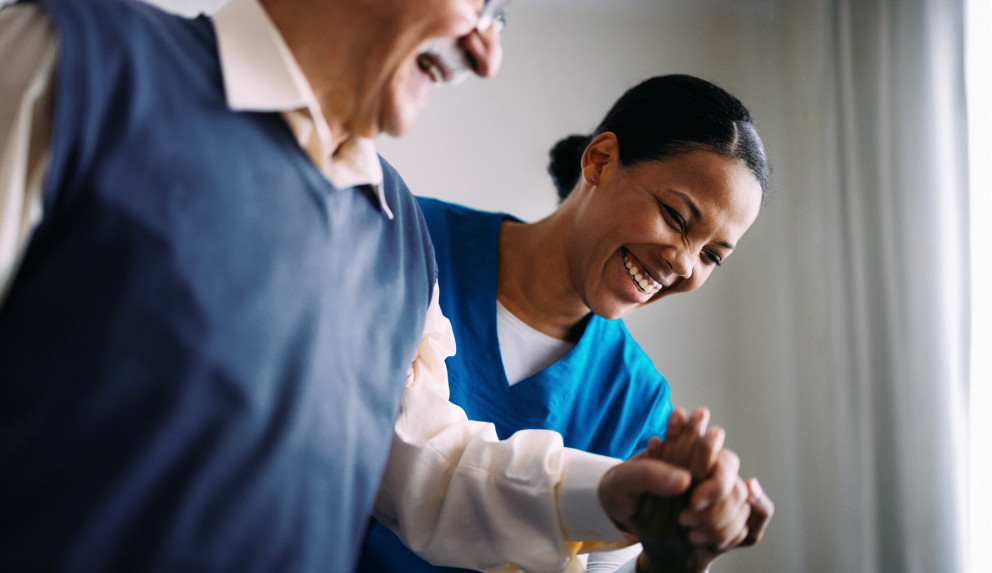 Caregiver helping elderly patient