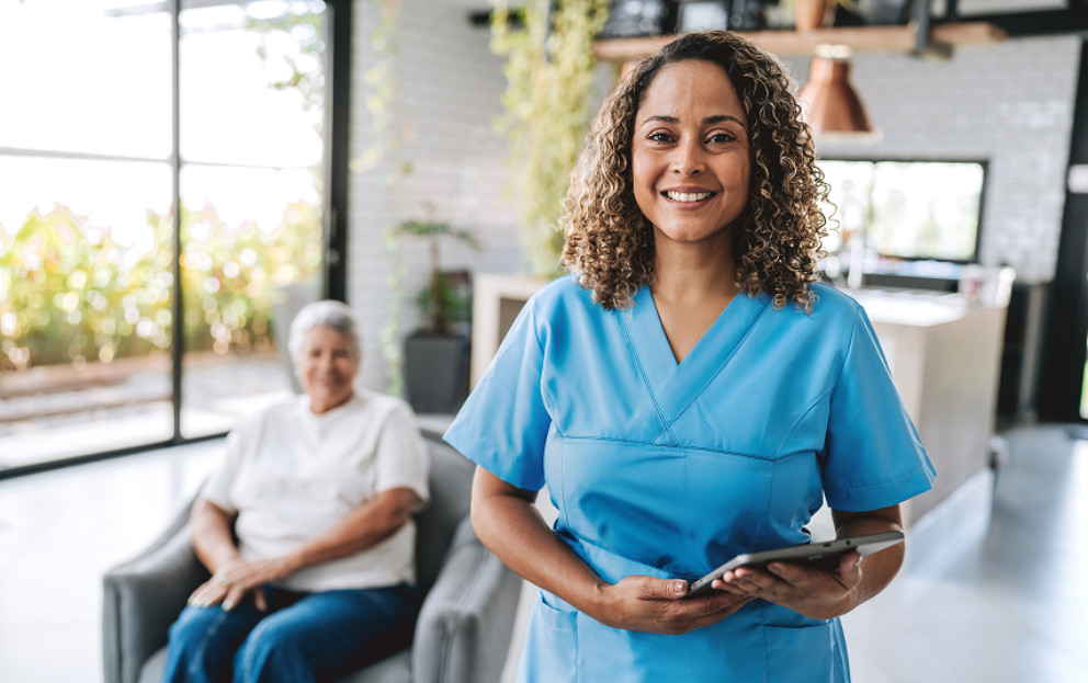 Caregiver standing in from of a personalized meeting